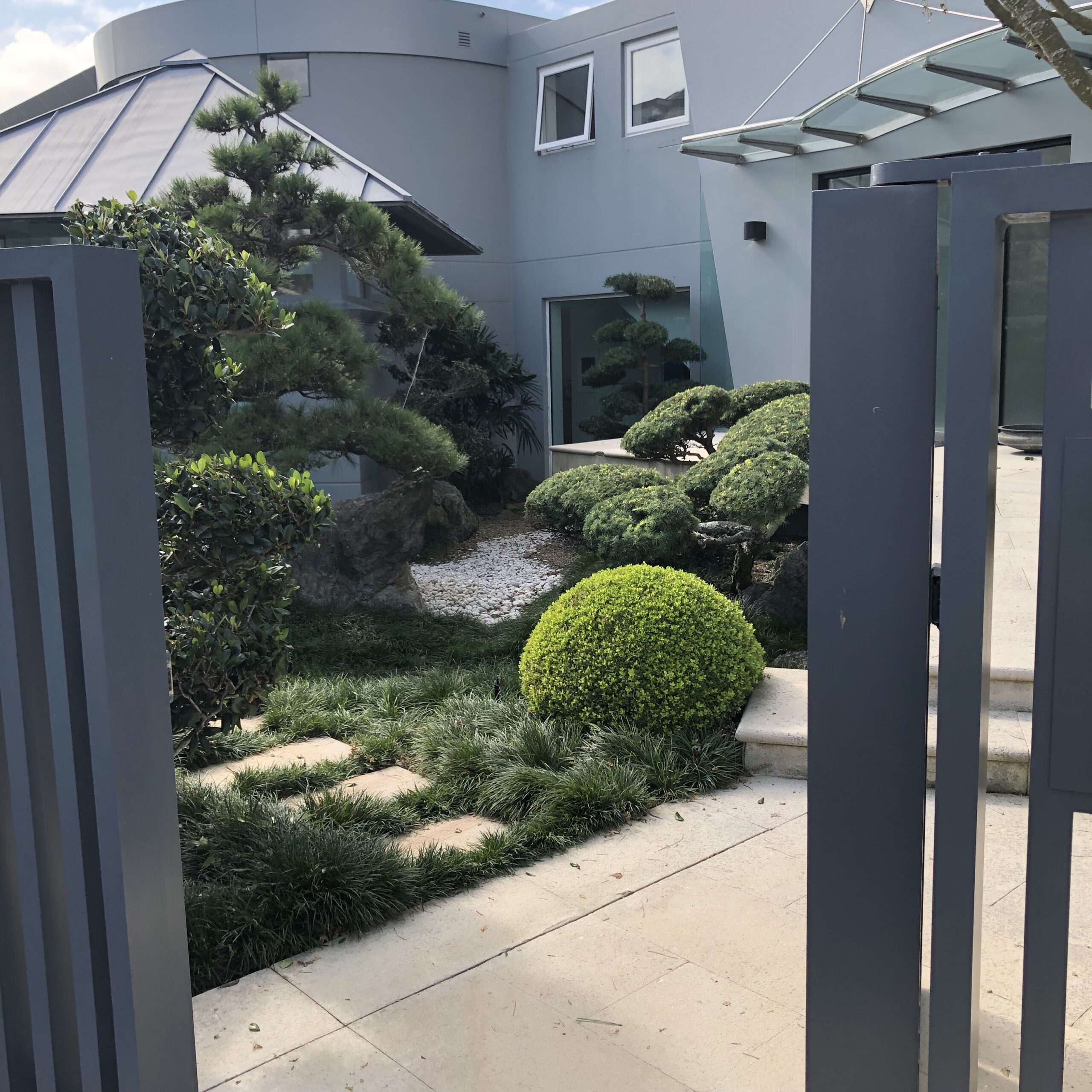 Through the gate to a beautiful contemporary Oriental garden